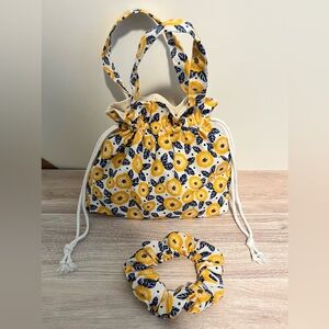 Handmade drawstring bag for little girls, color is yellow, white and blue.